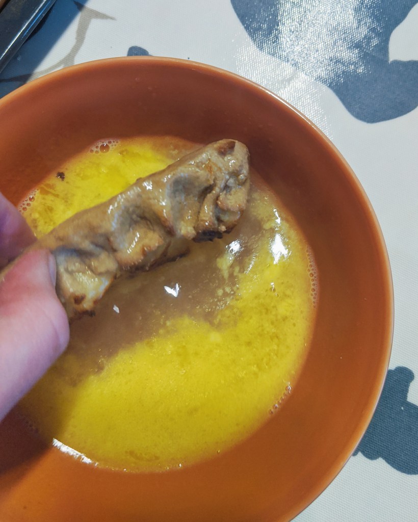 The easiest way of washing the cooked pies with the butter and water emulsion is to dunk them in and quickly turn and then lift back to the tray to drain.