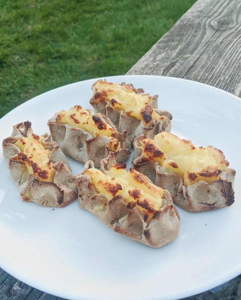 The pastry will have lovely brown caramelised bits on top when done. The butter and water wash will help them not be to hard.
