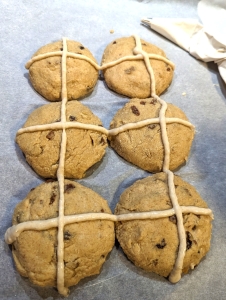 Gluten-Free hot cross buns with the crosses piped on (two long lines accros the two lines of buns and three lines across each pair of buns).