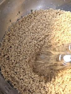 A closeup of the butter, sugar and flour mixture. It should look like wet sand or large breadcrumbs.